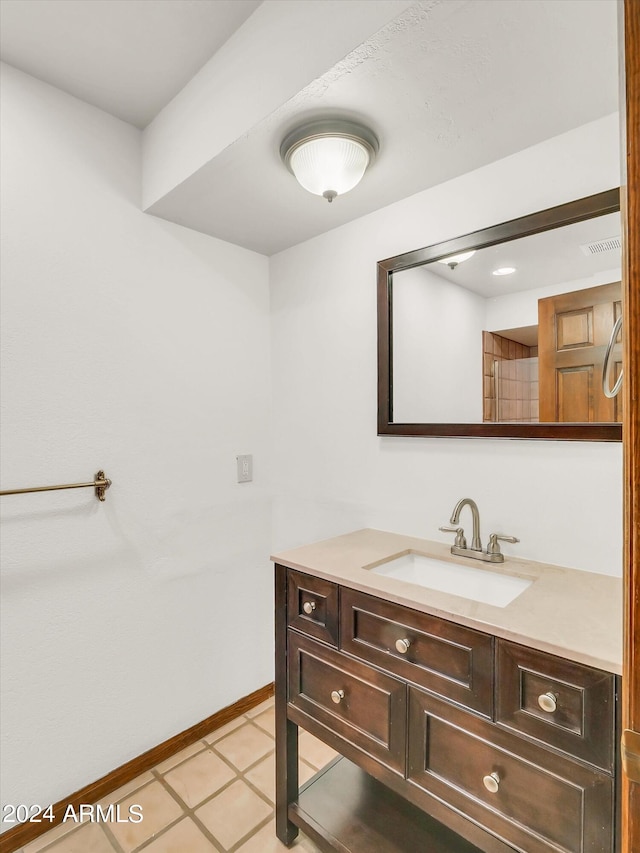 bathroom with tile floors and vanity