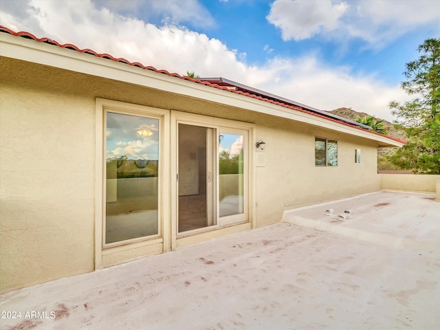 back of property featuring a patio