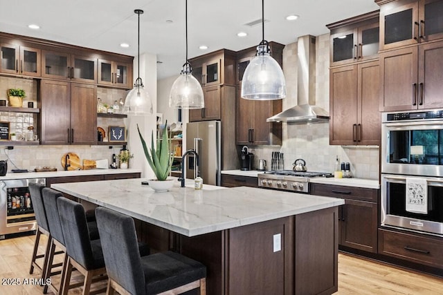 kitchen with open shelves, decorative backsplash, beverage cooler, wall chimney range hood, and stainless steel appliances