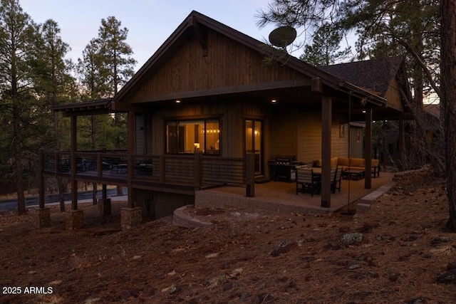 exterior space with an outdoor hangout area and a patio area