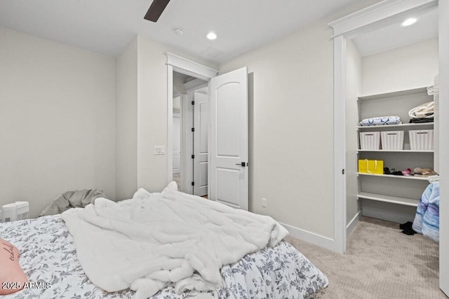 carpeted bedroom featuring baseboards, ceiling fan, and recessed lighting