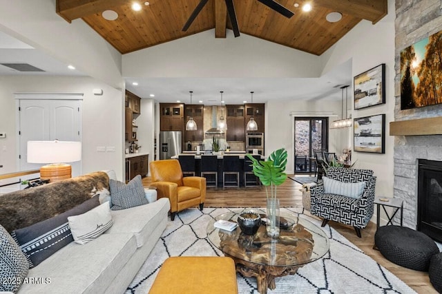 living room featuring recessed lighting, light wood-style flooring, and ceiling fan
