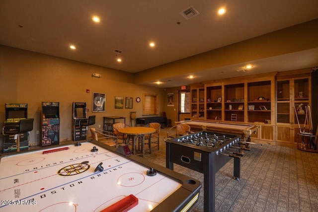 recreation room with visible vents, recessed lighting, and carpet floors