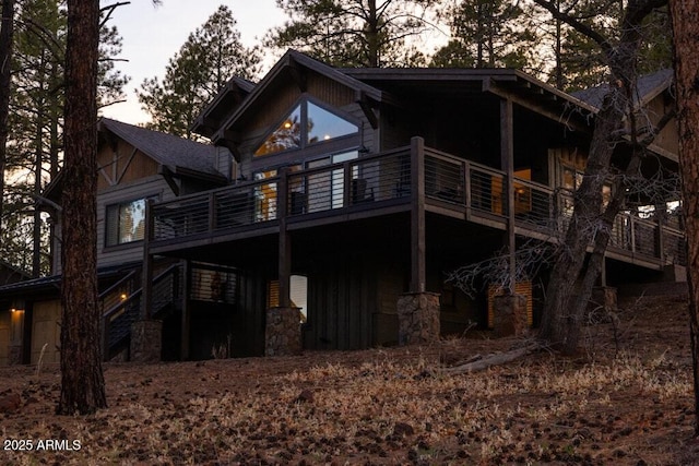 back of house with a deck