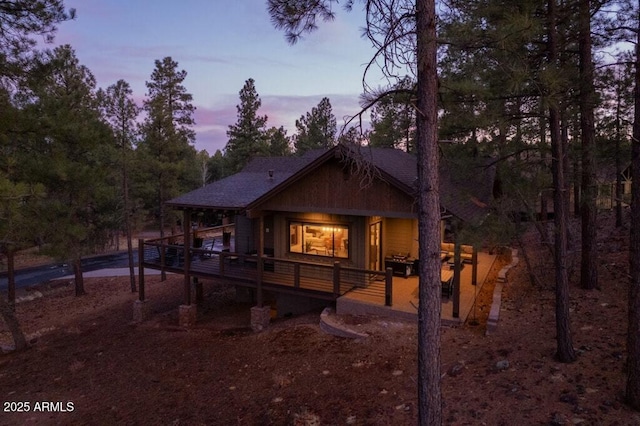 view of back of house at dusk