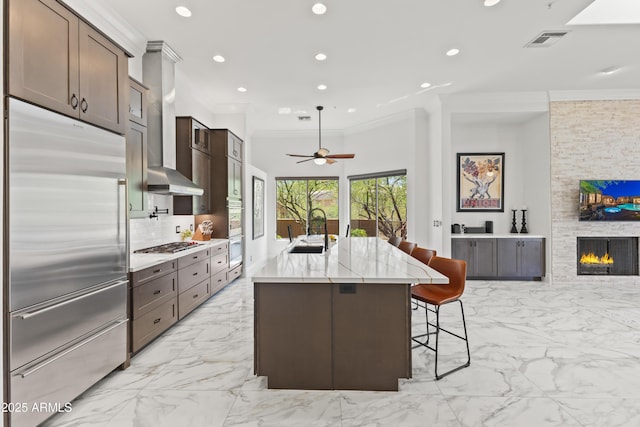 30600 N Pima Rd N Unit 81, Scottsdale, AZ 85266 - kitchen with appliances with stainless steel finishes, a sink, light marble finish floors, ornamental molding, and recessed lighting