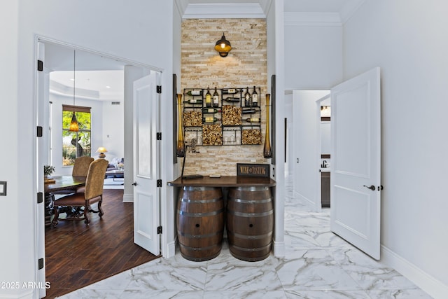 30600 N Pima Rd N Unit 81, Scottsdale, AZ 85266 - hall featuring ornamental molding, baseboards, marble finish flooring, and a towering ceiling