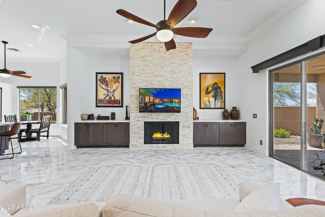 30600 N Pima Rd N Unit 81, Scottsdale, AZ 85266 - living area with a ceiling fan, light marble finish flooring, ornamental molding, a fireplace, and baseboards