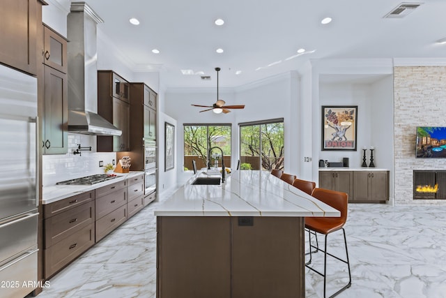 30600 N Pima Rd N Unit 81, Scottsdale, AZ 85266 - kitchen featuring a sink, stainless steel appliances, light marble finish floors, a breakfast bar, and ornamental molding
