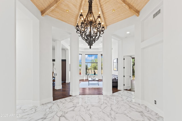 30600 N Pima Rd N Unit 81, Scottsdale, AZ 85266 - foyer entrance featuring wood ceiling, a chandelier, marble tiled flooring, beam ceiling, and a high ceiling
