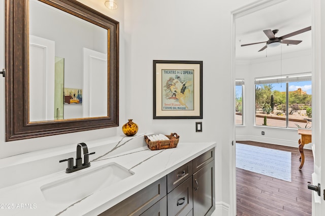 30600 N Pima Rd N Unit 81, Scottsdale, AZ 85266 - bathroom featuring wood finished floors, vanity, a ceiling fan, baseboards, and crown molding