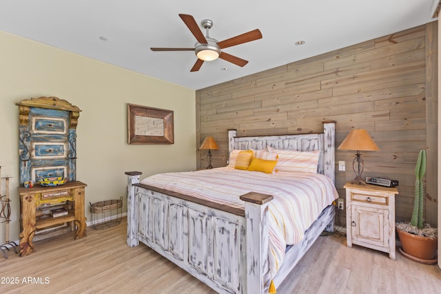 30600 N Pima Rd N Unit 81, Scottsdale, AZ 85266 - bedroom featuring wooden walls, light wood-style floors, and a ceiling fan