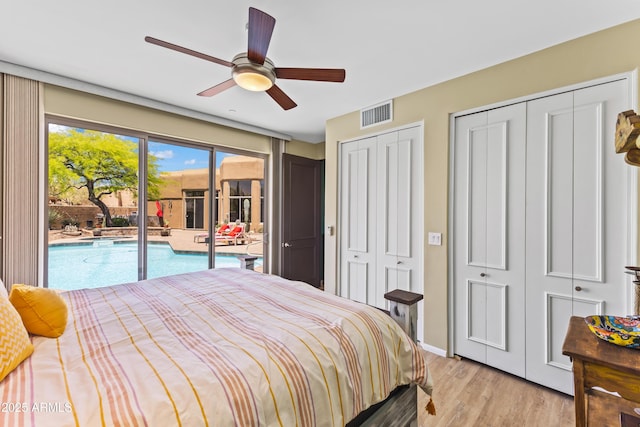 30600 N Pima Rd N Unit 81, Scottsdale, AZ 85266 - bedroom with access to exterior, two closets, light wood finished floors, a ceiling fan, and baseboards