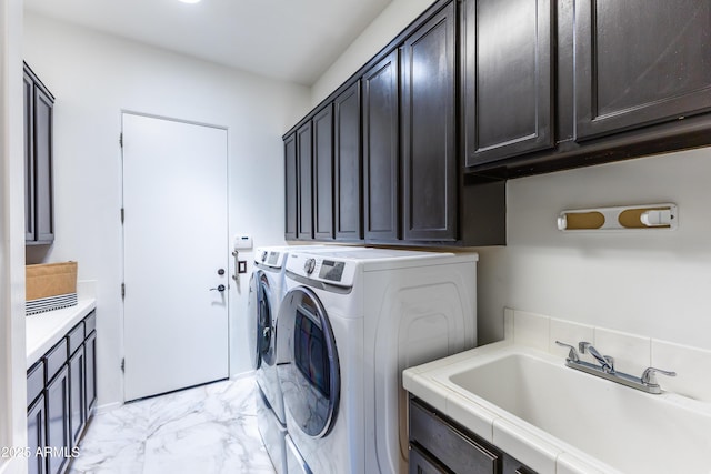 30600 N Pima Rd N Unit 81, Scottsdale, AZ 85266 - laundry room featuring cabinet space, separate washer and dryer, and light marble finish flooring