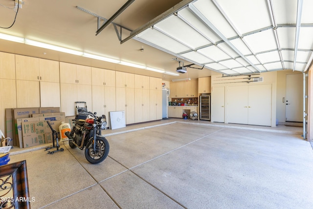 30600 N Pima Rd N Unit 81, Scottsdale, AZ 85266 - garage with a garage door opener and wine cooler