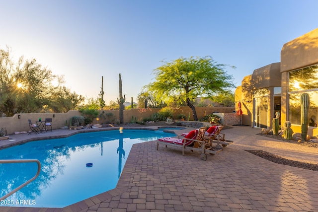 30600 N Pima Rd N Unit 81, Scottsdale, AZ 85266 - pool at dusk with a fenced backyard and a patio area