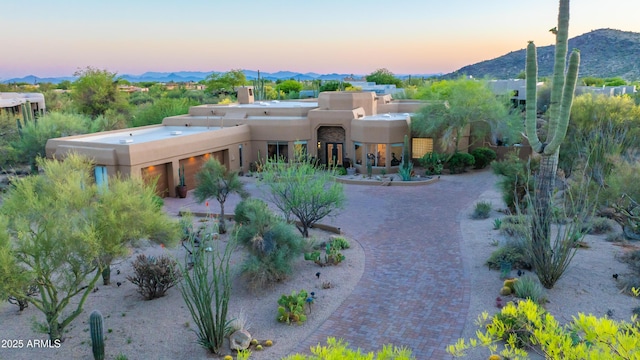 30600 N Pima Rd N Unit 81, Scottsdale, AZ 85266 - view of front of property featuring stucco siding, a mountain view, and a chimney
