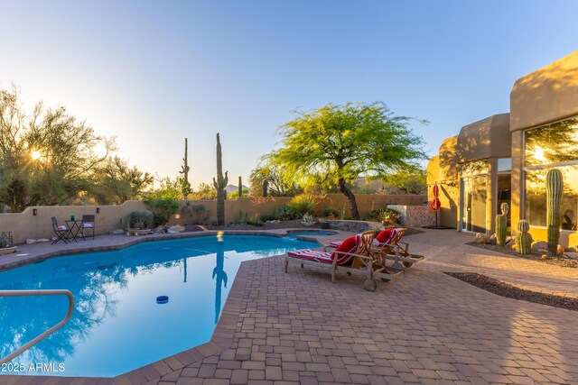 30600 N Pima Rd N Unit 81, Scottsdale, AZ 85266 - pool at dusk with a fenced backyard and a patio area