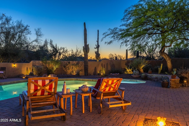 30600 N Pima Rd N Unit 81, Scottsdale, AZ 85266 - pool at dusk with a fenced backyard and a patio