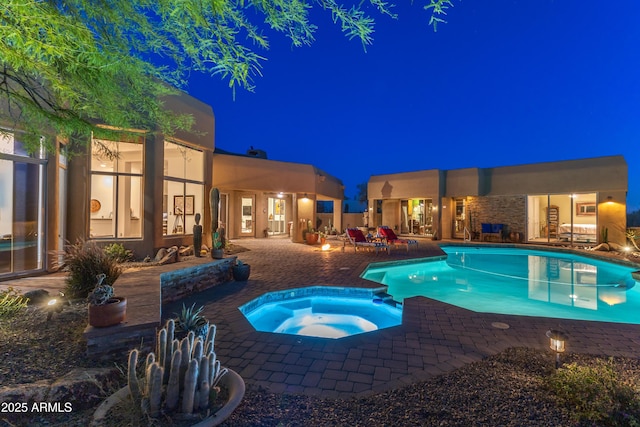 30600 N Pima Rd N Unit 81, Scottsdale, AZ 85266 - pool at night with a patio and a pool with connected hot tub