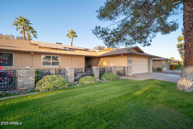 ranch-style home featuring solar panels, a garage, and a front lawn