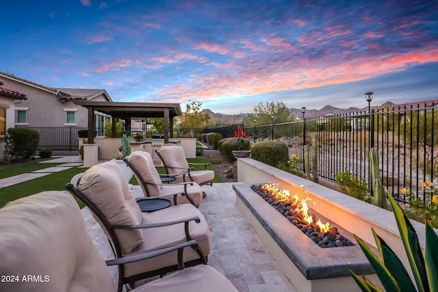 patio terrace at dusk with an outdoor fire pit