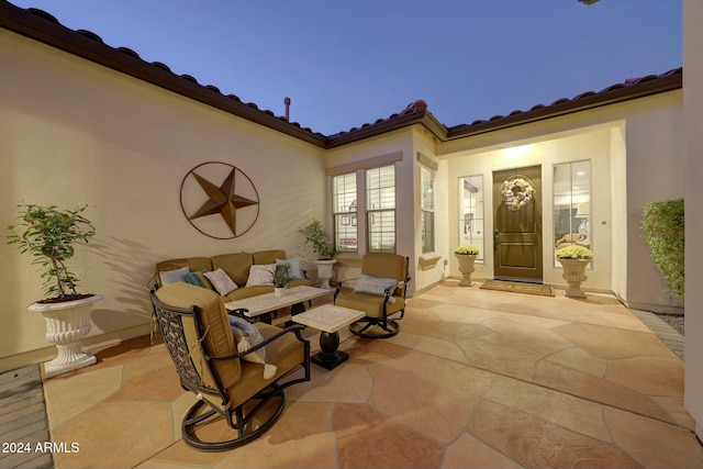 view of patio terrace at dusk