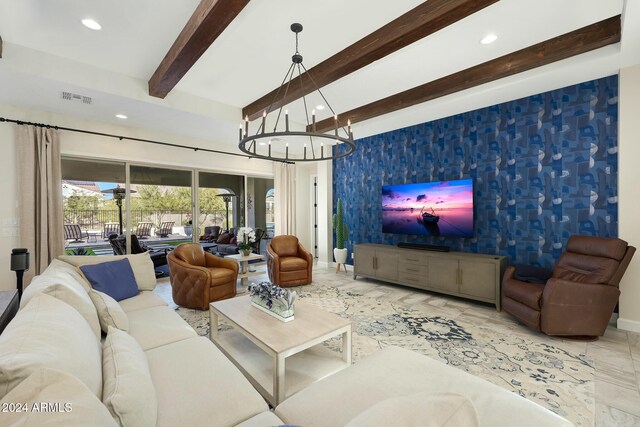 living room with beam ceiling and an inviting chandelier