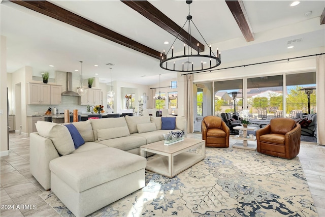 living room with beam ceiling and a chandelier