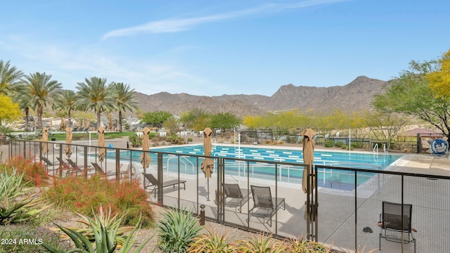 view of swimming pool featuring a mountain view