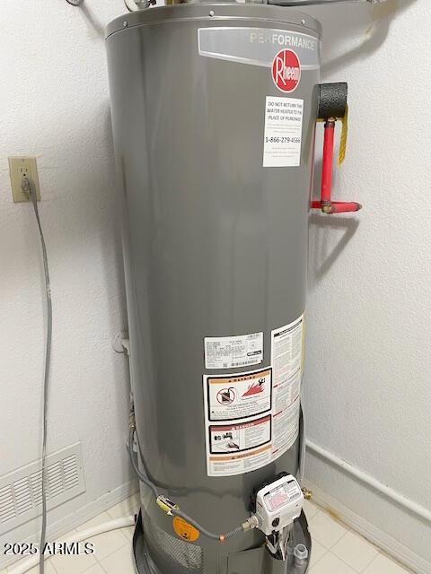 utility room featuring gas water heater