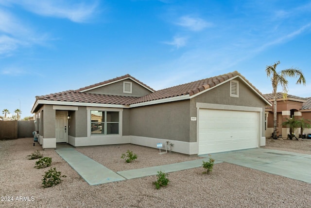 ranch-style home with a garage