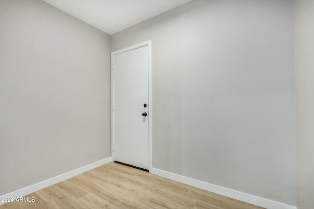 unfurnished room featuring light hardwood / wood-style floors