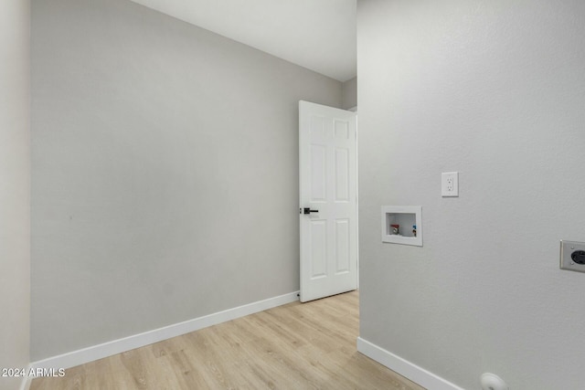 clothes washing area featuring washer hookup, light wood-type flooring, and hookup for an electric dryer