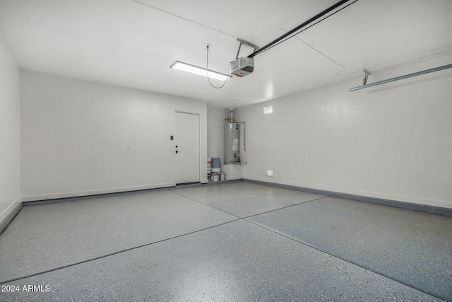 garage featuring a garage door opener and gas water heater