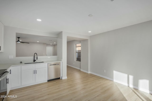 kitchen featuring white cabinetry, light hardwood / wood-style flooring, sink, and appliances with stainless steel finishes