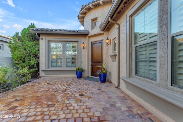 doorway to property featuring a patio