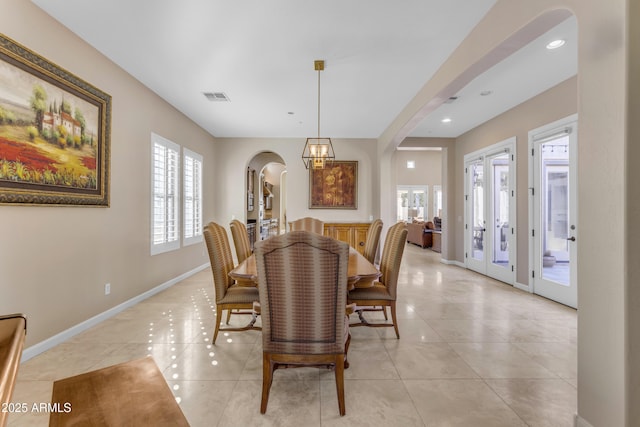 dining space featuring light tile patterned flooring