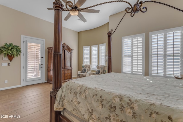 bedroom with light hardwood / wood-style floors, ceiling fan, and access to outside