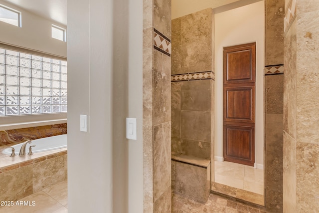 bathroom with independent shower and bath, a wealth of natural light, and tile patterned flooring