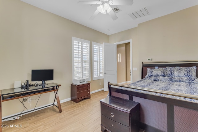 bedroom with ceiling fan and light hardwood / wood-style floors