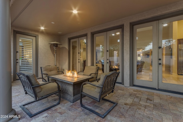 view of patio with a fire pit and french doors