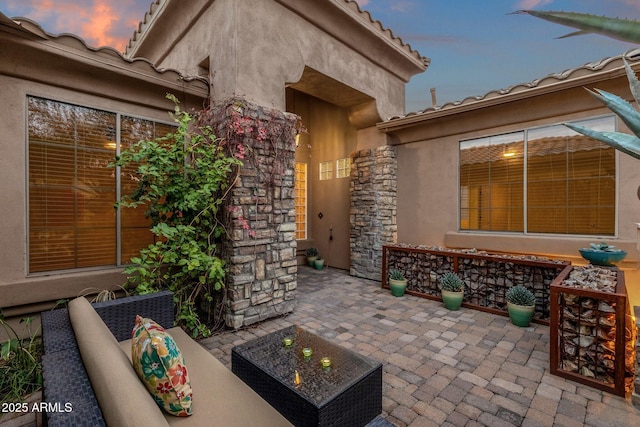 patio terrace at dusk with an outdoor hangout area