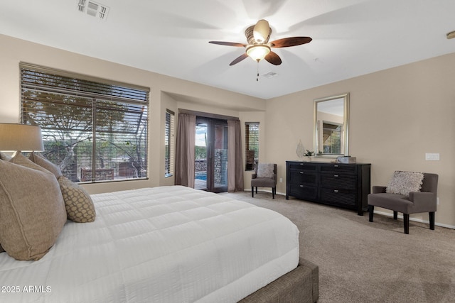 bedroom featuring ceiling fan and light carpet