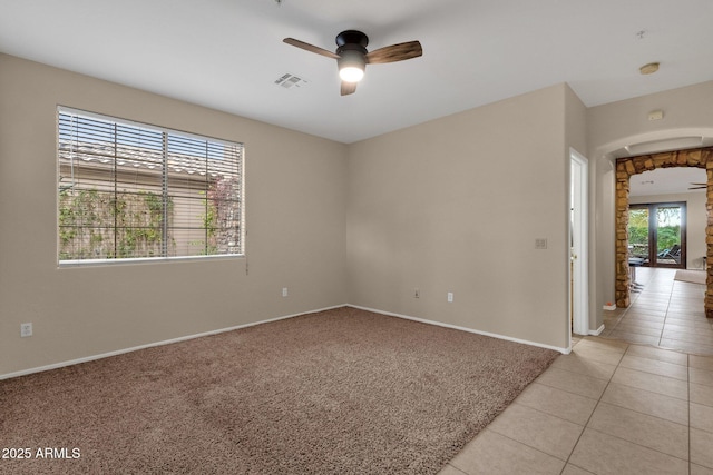 carpeted empty room with ceiling fan