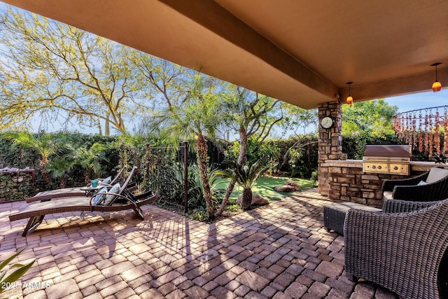 view of patio with area for grilling and grilling area