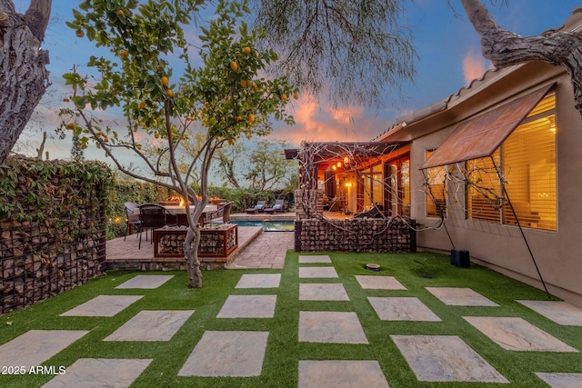 view of patio terrace at dusk