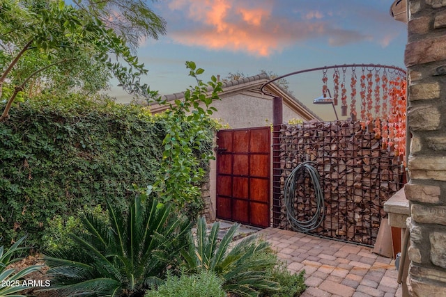 view of gate at dusk