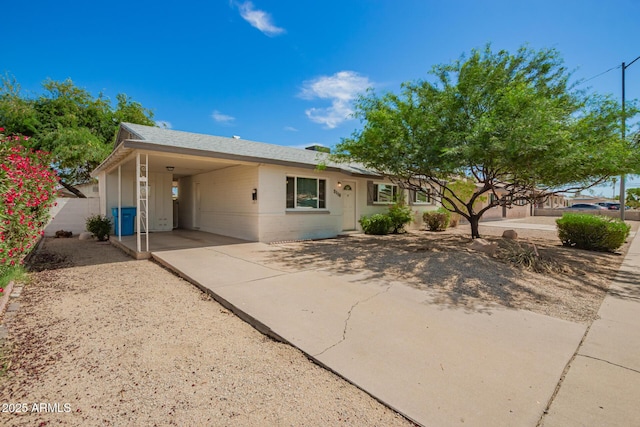 3118 W Aster Dr, Phoenix, AZ 85029 - ranch-style house featuring an attached carport, driveway, and concrete block siding