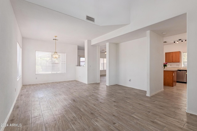 6350 W Hess St, Phoenix, AZ 85043 - unfurnished room with wood-type flooring and a chandelier